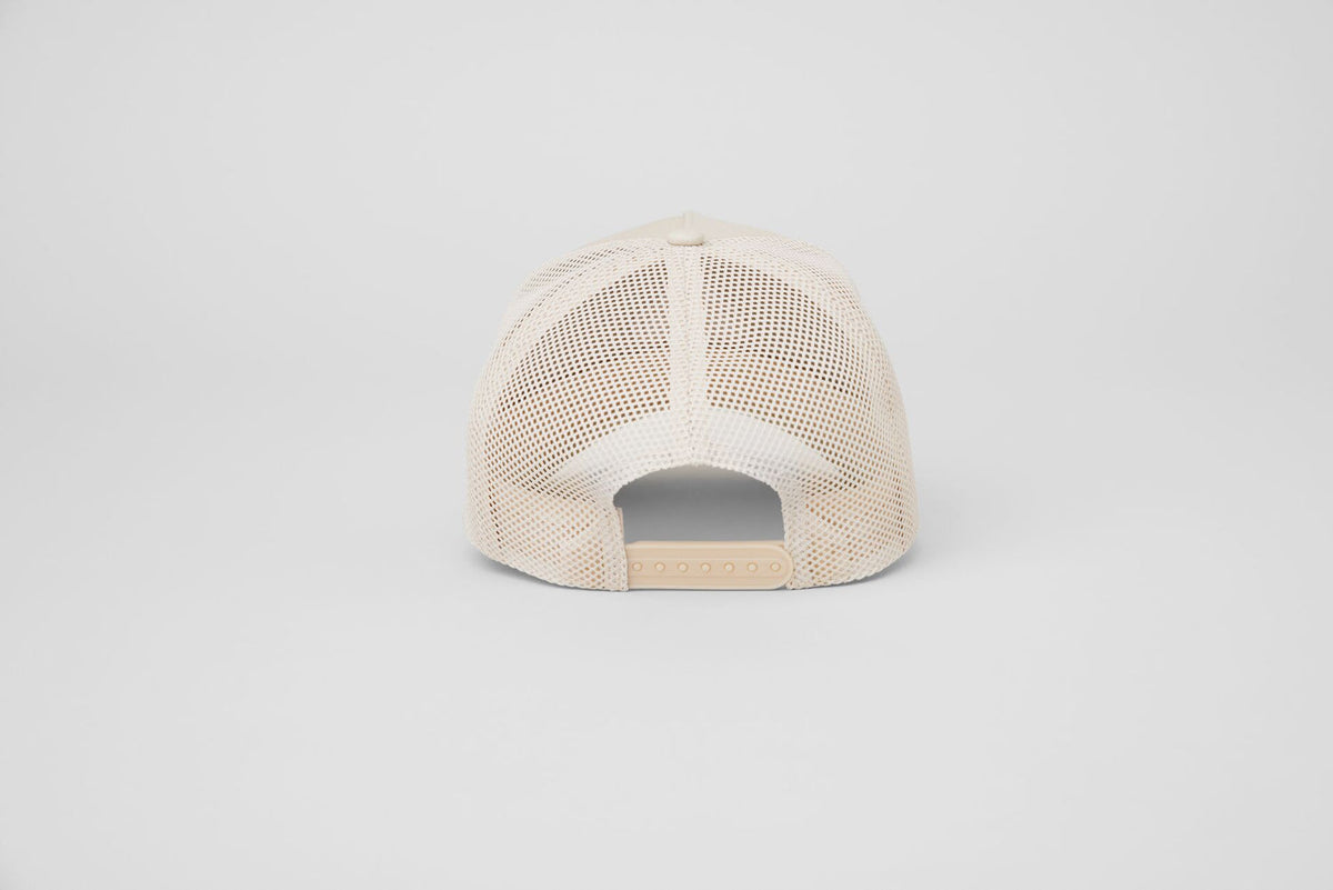 Gorra de camionero District - Hueso